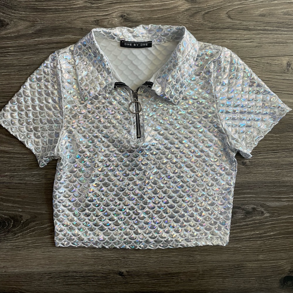 Holographic dolls kill top